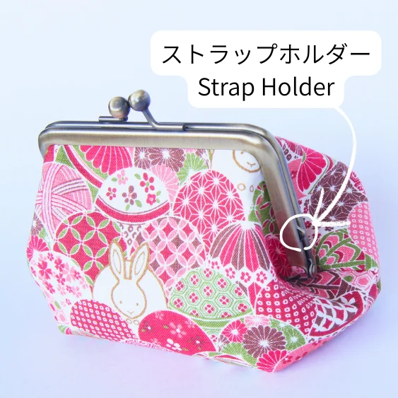 Strap holder attached to the clasp