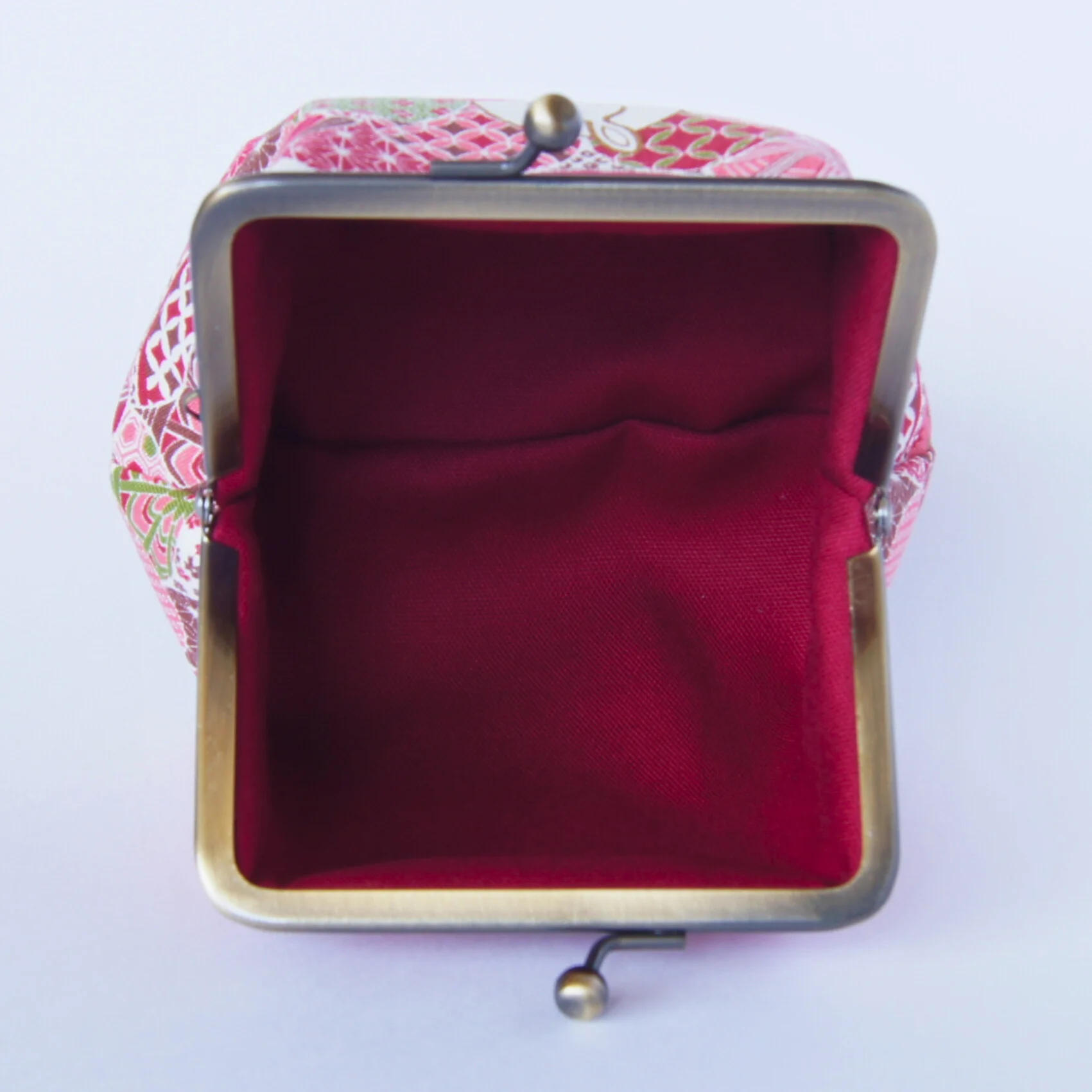 A third view of the red rabbit-pattern pouch, color 2