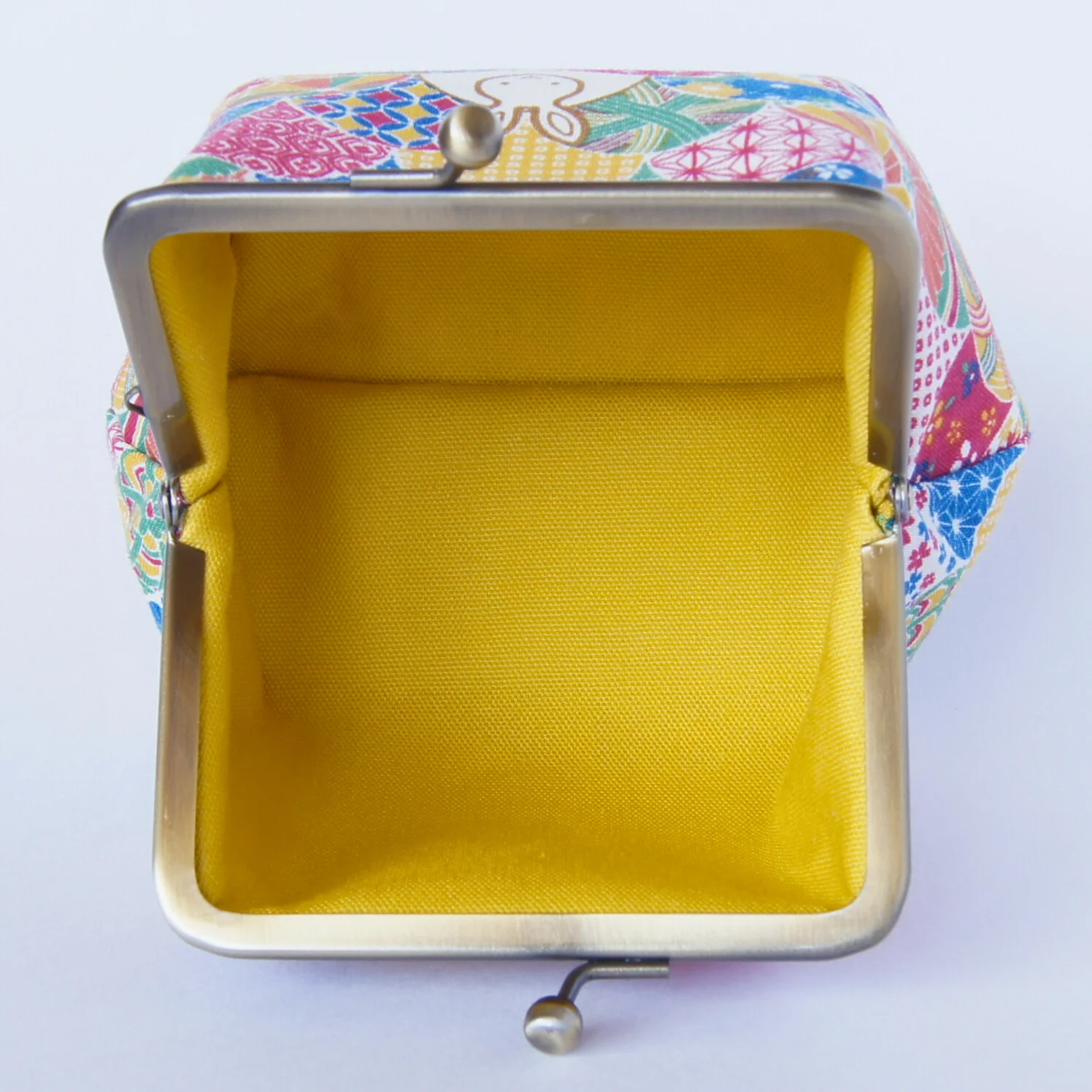 A third view of the yellow rabbit-pattern pouch, color 3