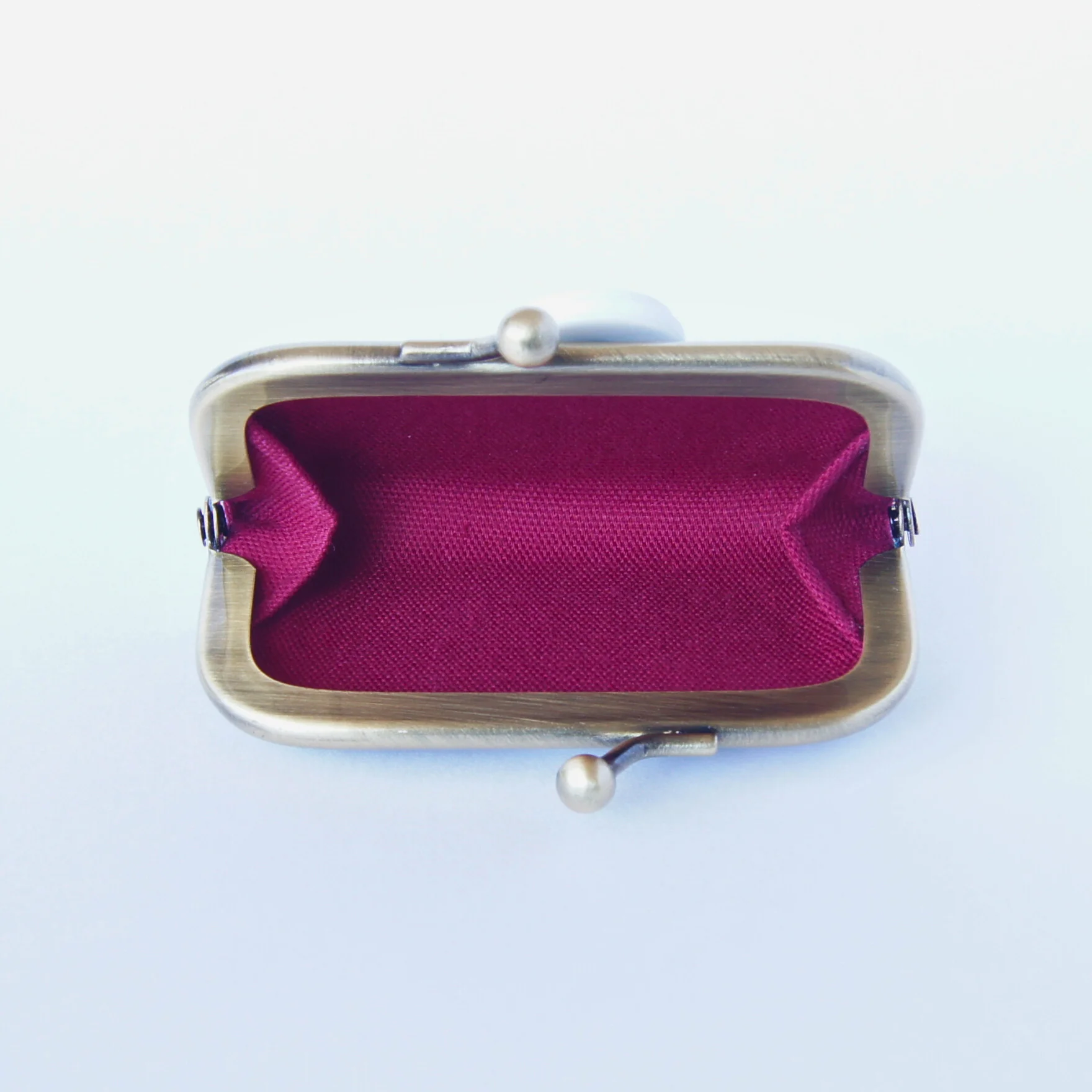 The purse opened wide, showing its gusseted sides