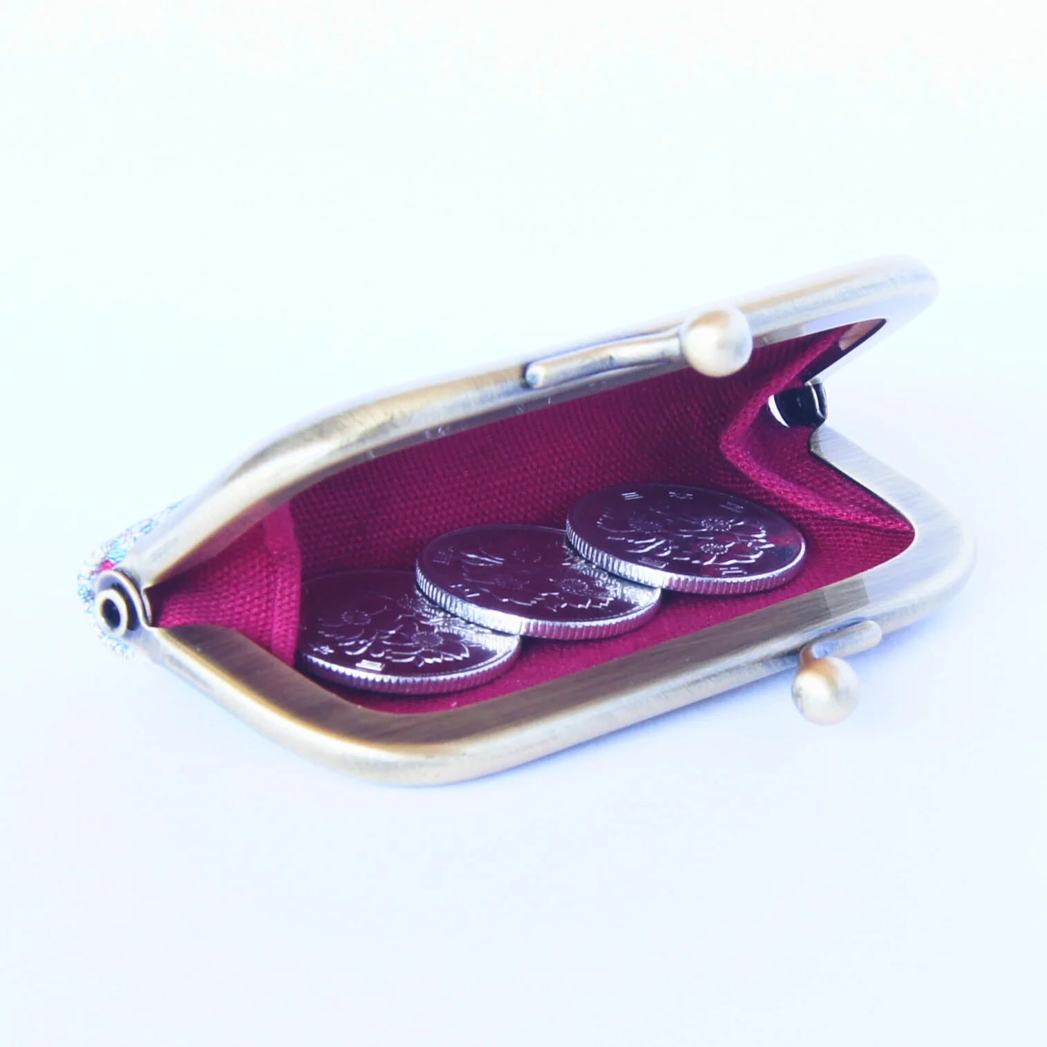 Coins and small items kept inside the open purse