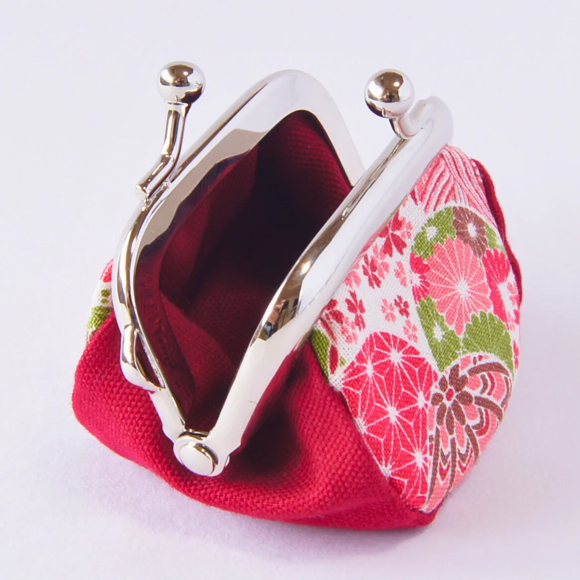 Strap holder on the purse for attaching it to a neck strap or bag