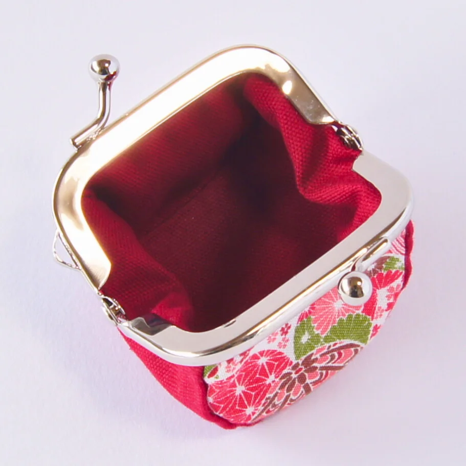 The purse opened wide, showing its inner gusset