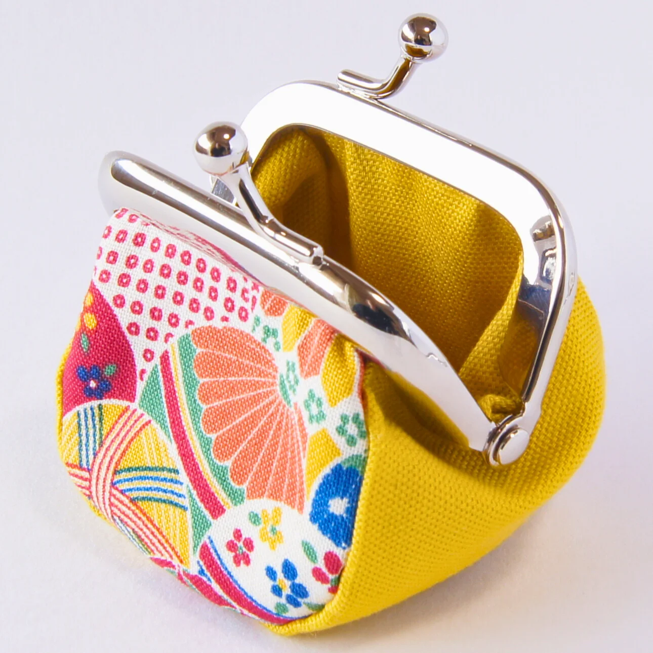 A fourth view of the yellow Mari and Sakura purse, color 1
