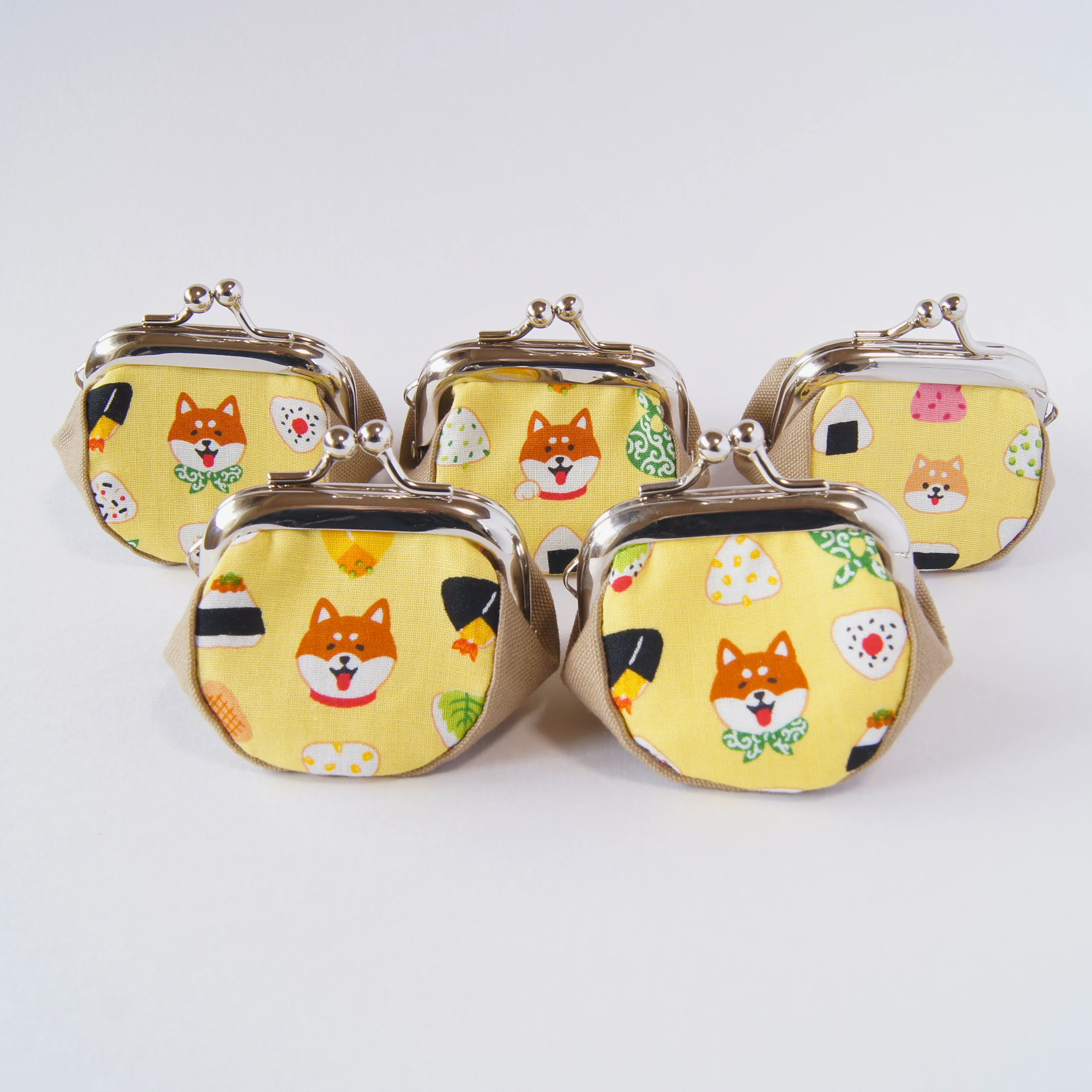 Shiba Inu faces and onigiri motifs across the fabric