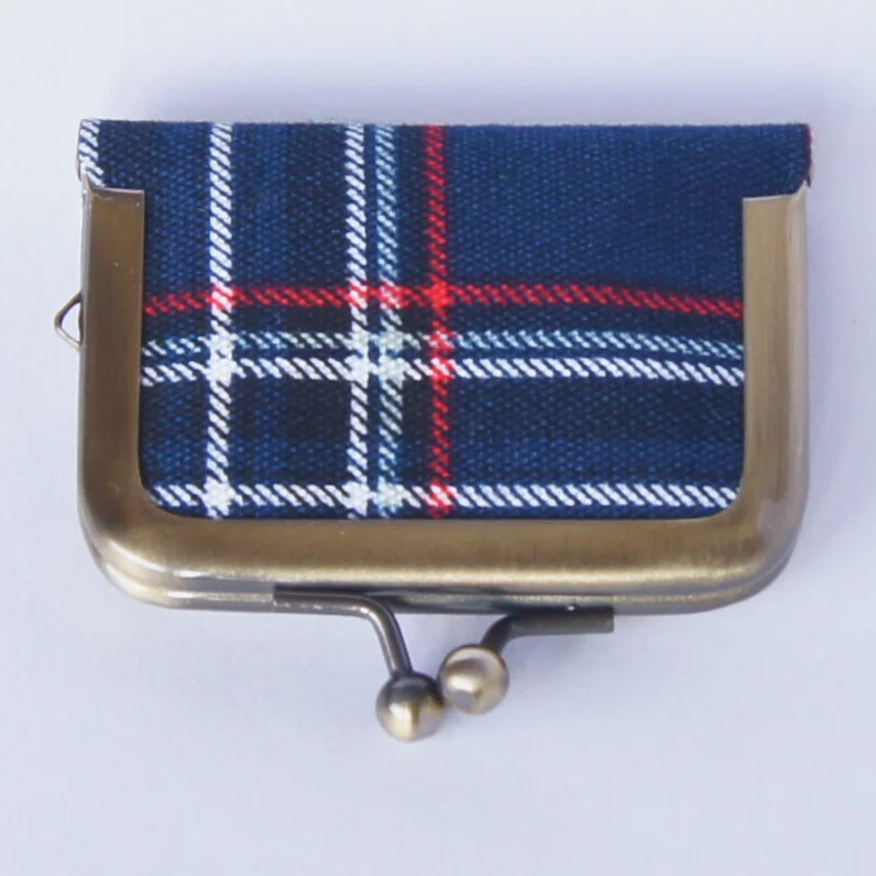 Another view of the navy tartan-check pouch, color 1