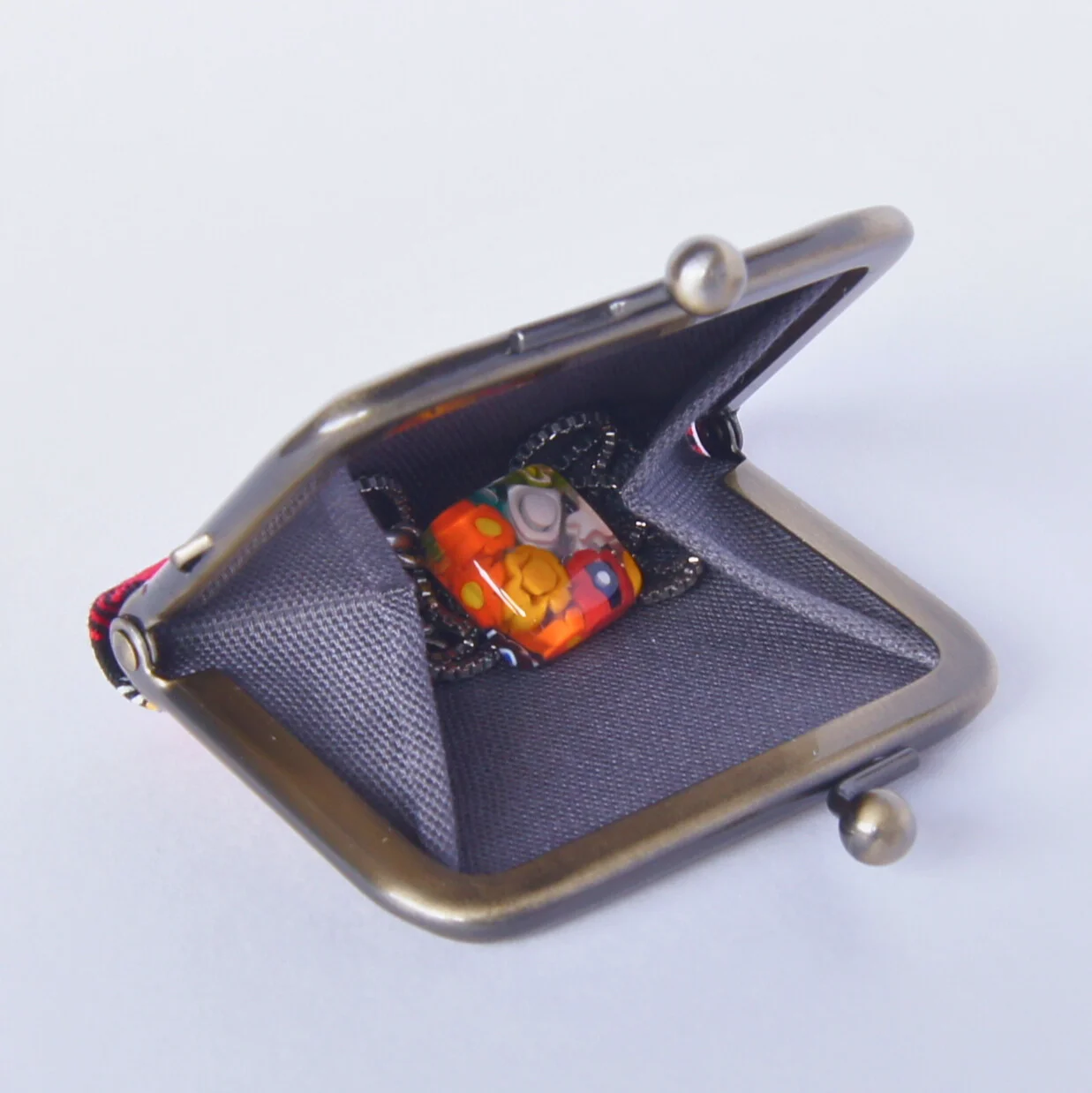 The gusset cushioning jewelry inside the pouch