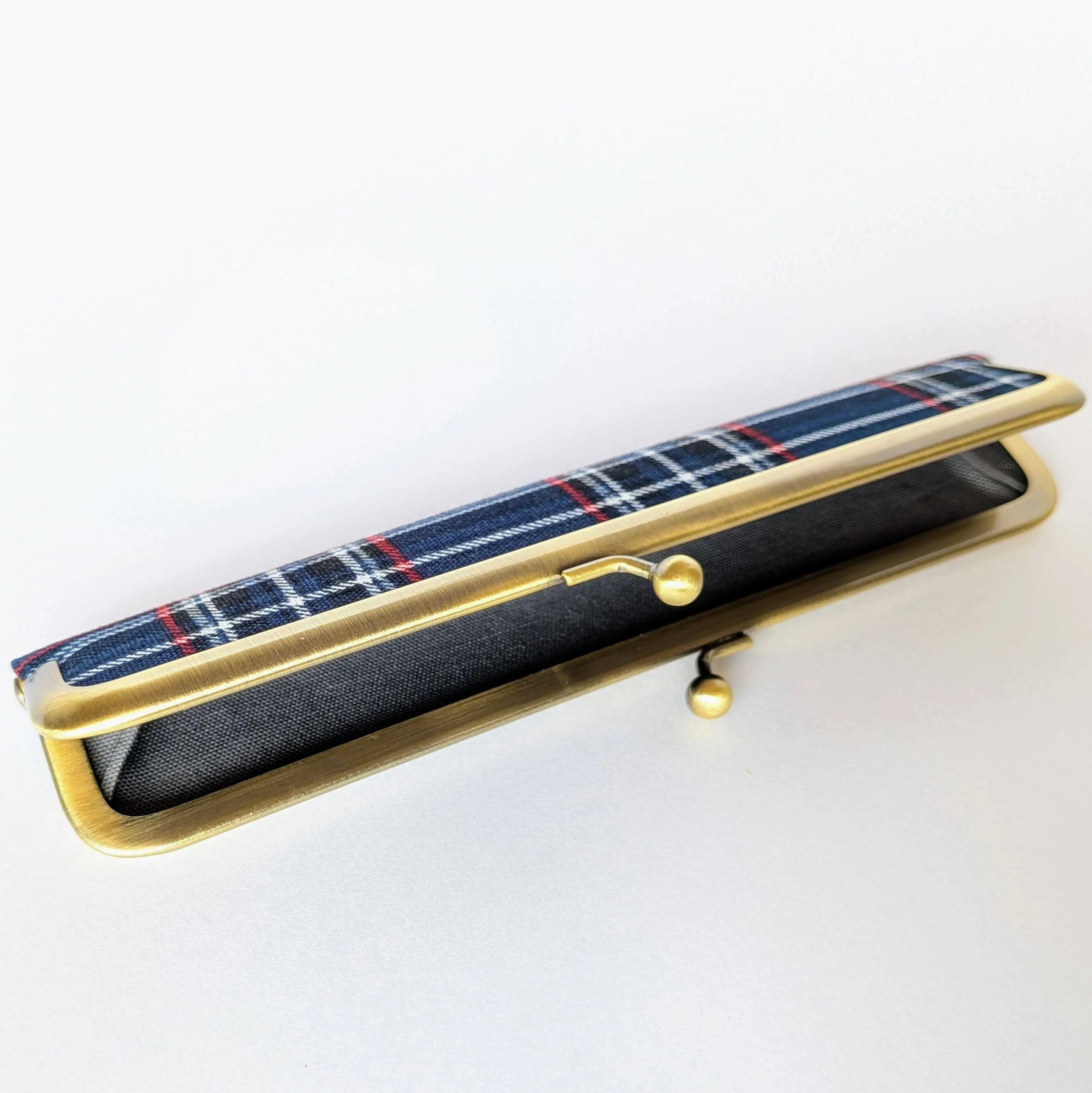 The pen case slightly open, showing its interior
