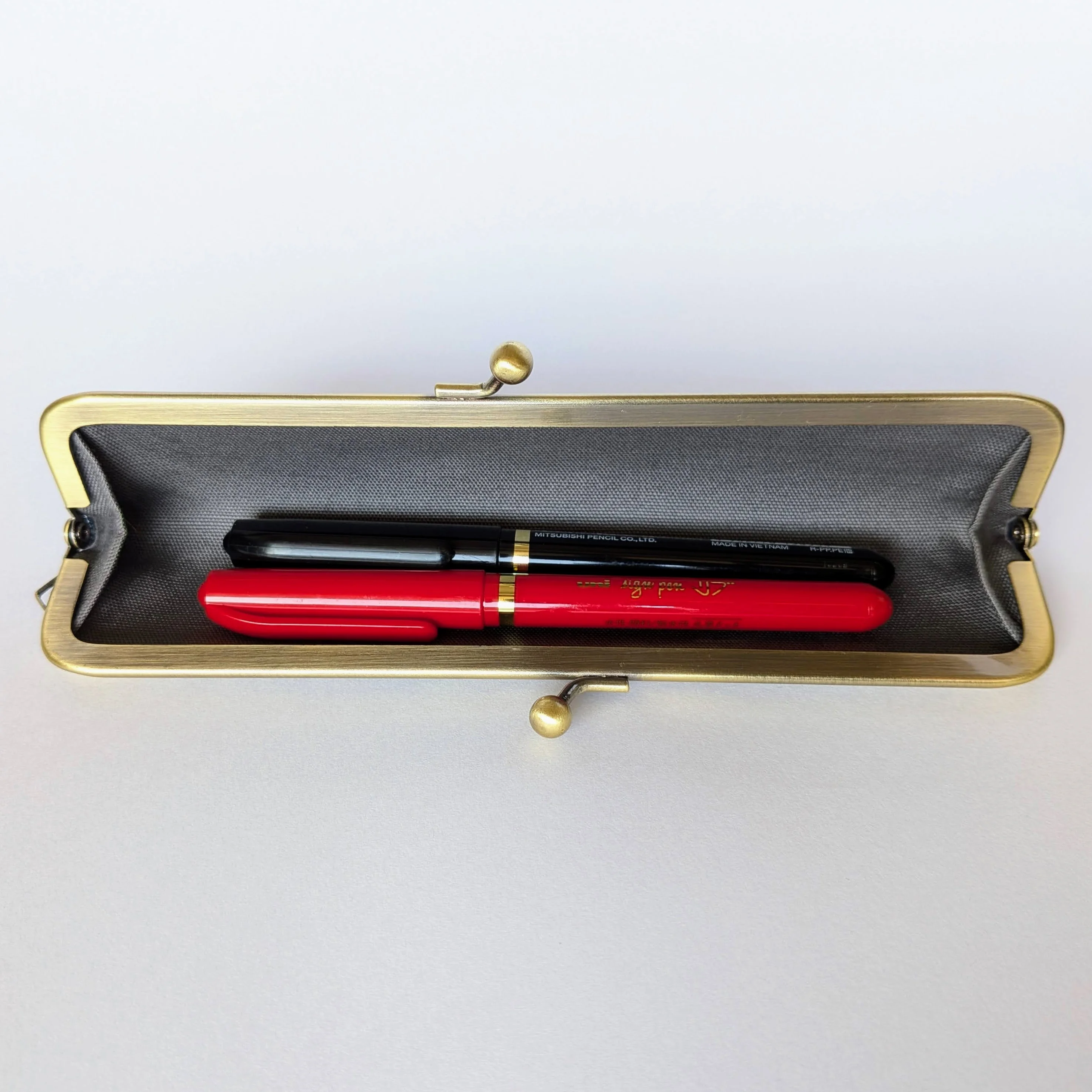 Two pens inside the slim pen case